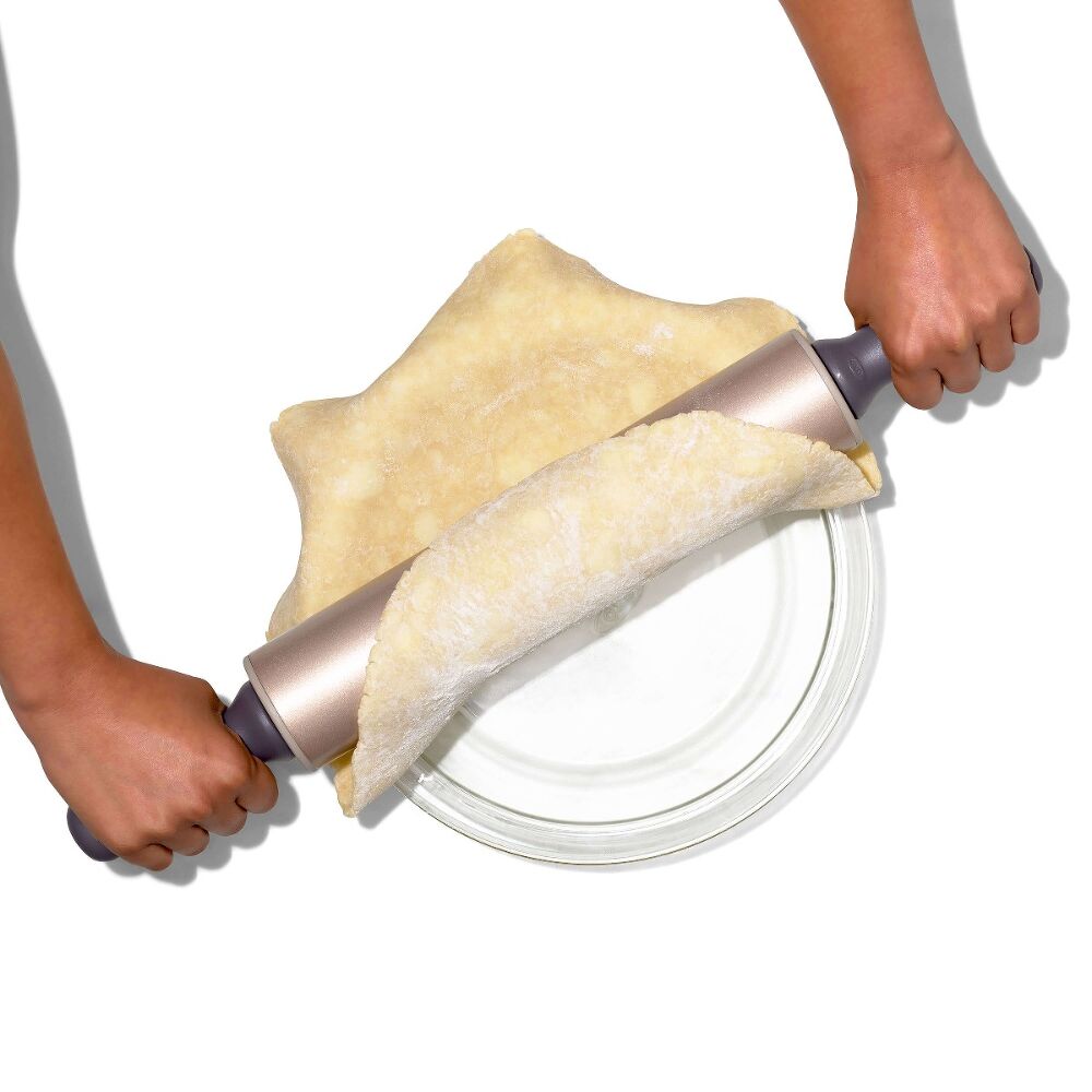 OXO non-stick rolling pin transferring pastry to a pie dish