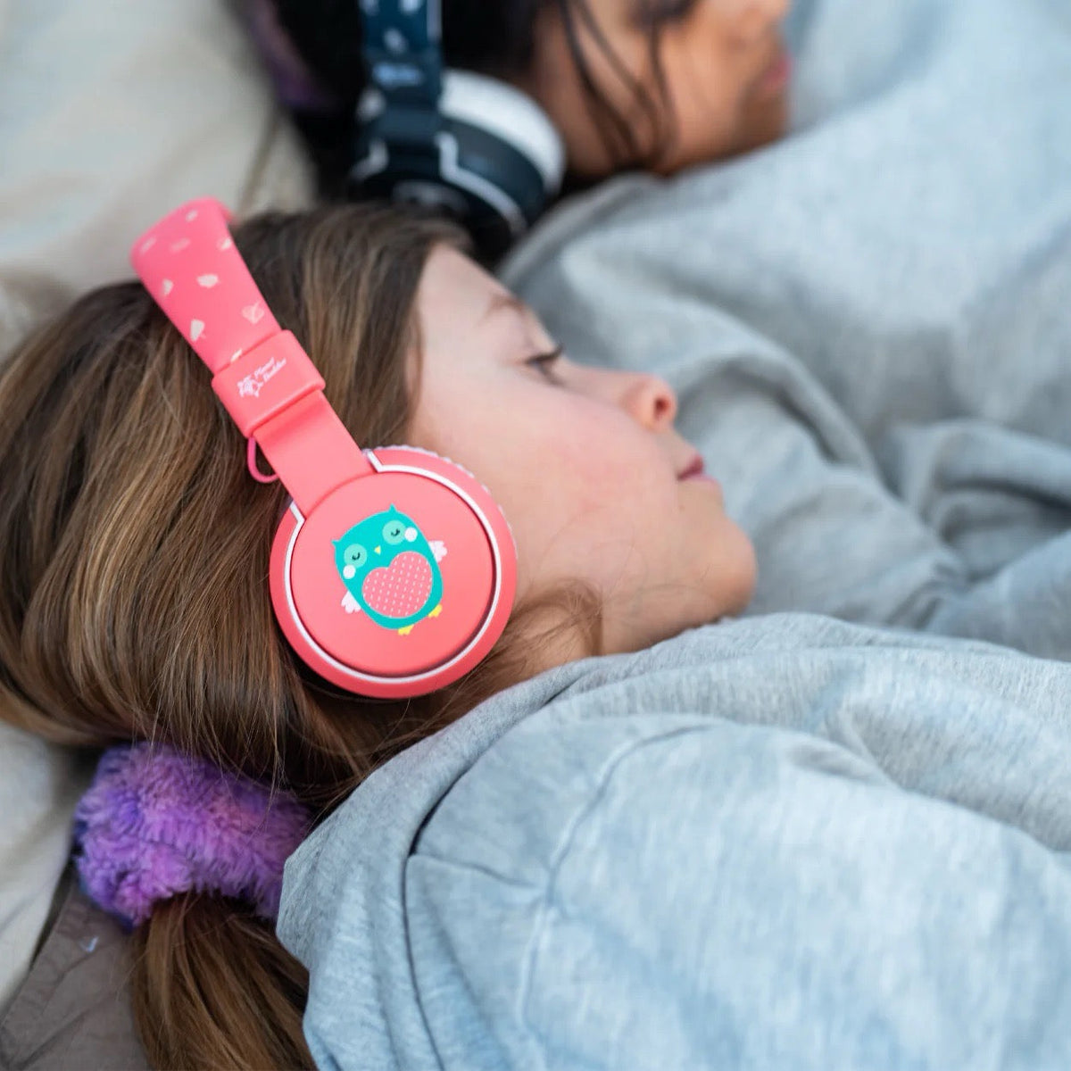 Planet Buddies Olive the Owl wireless headphones being worn