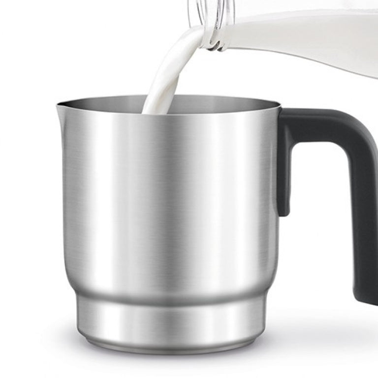 Breville Choc & Cino LMF200 pouring hot chocolate from the frothing jug