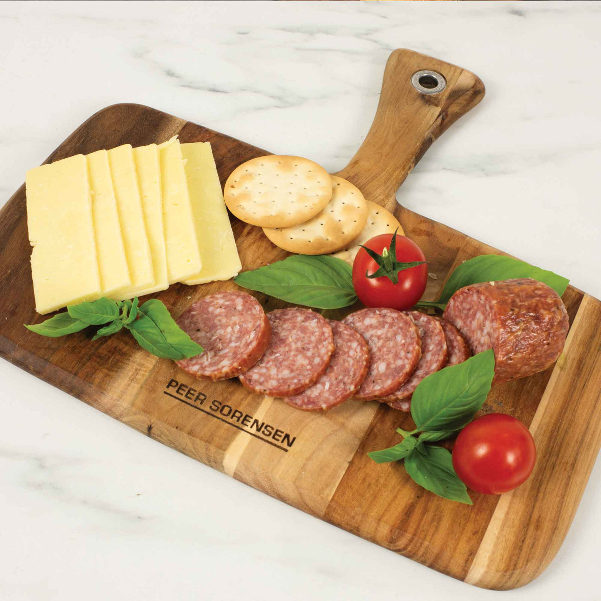 Peer Sorensen acacia paddle board serving cheese and charcuterie