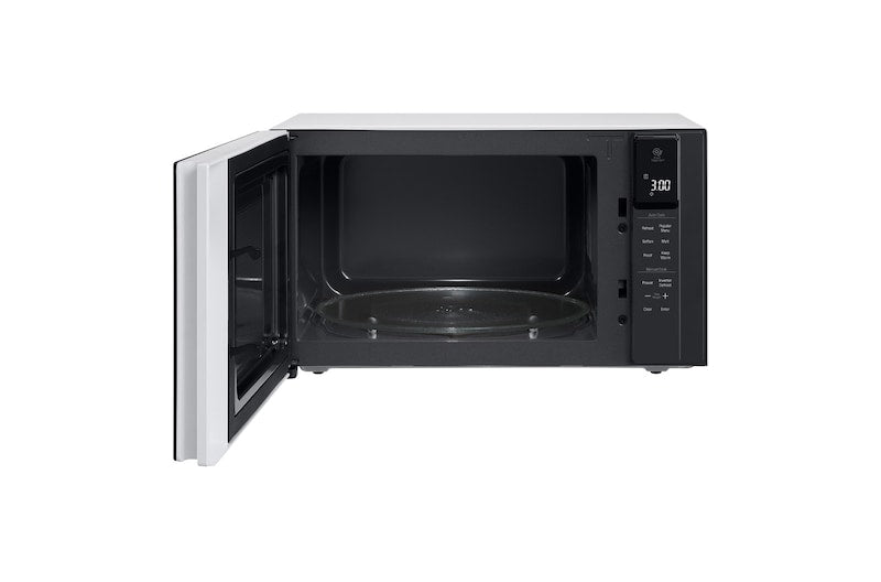 LG NeoChef MS2596OW 25L microwave with door open showing interior