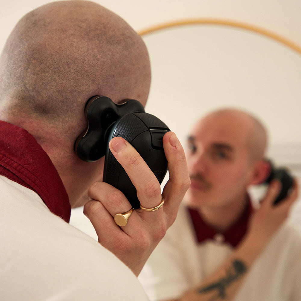 Remington HC7500AU head shaver in use on scalp